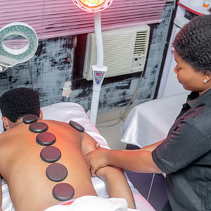 Hot stone massage service in egbeda Lagos by estreme therapy
